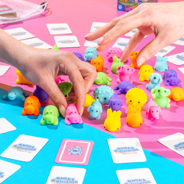 Swipe the Squishie sensory board game encouraging reaction speed, pattern recognition, and screen-free playtime for kids. Sensory board game for kids featuring tactile squishy, animal and colour recognition, and fine motor skill development