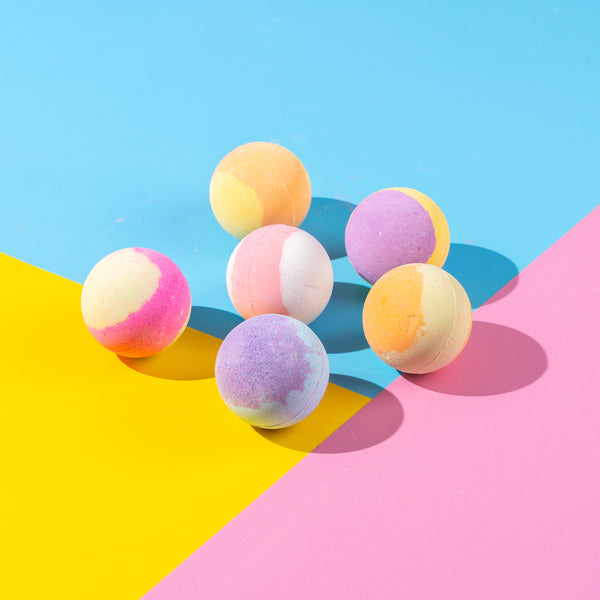 6 fruit-scented bath bombs with surprise squishy fidget toys inside, ideal for sensory play and stress-free bathtimes