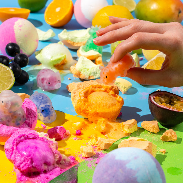 Children’s bath bomb gift set with vibrant fizz, fun scents like strawberry and orange, and surprise sensory squishy toys inside
