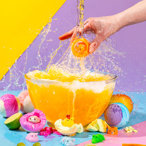 Fizzing bath bombs for kids with calming scents and sensory squishy toy hidden in each bath fizzer for surprise-filled bathtime