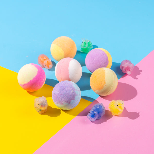 Fizzing bath bombs for kids with calming scents and sensory squishy toy hidden in each bath fizzer for surprise-filled bathtime