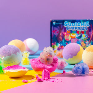Six-pack of colourful fruity-scented bath bombs with hidden squishie sensory toys, designed for kids aged 3 and up