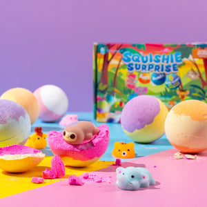 Squishie Surprise bath bomb set featuring shea butter and cocoa butter for gentle skin care and exciting toy reveals